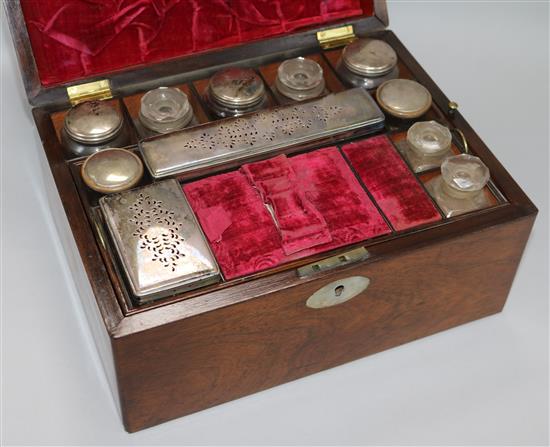 A Victorian rosewood toilet box, with fitted interior	